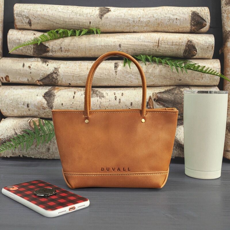 Very small tan leather purse