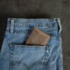 Men's vintage brown credit card wallet in jean pocket