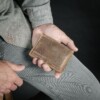 Man holding slim compact credit card wallet made in USA