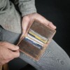 Vinatge brown wallet that holds money and credit cards