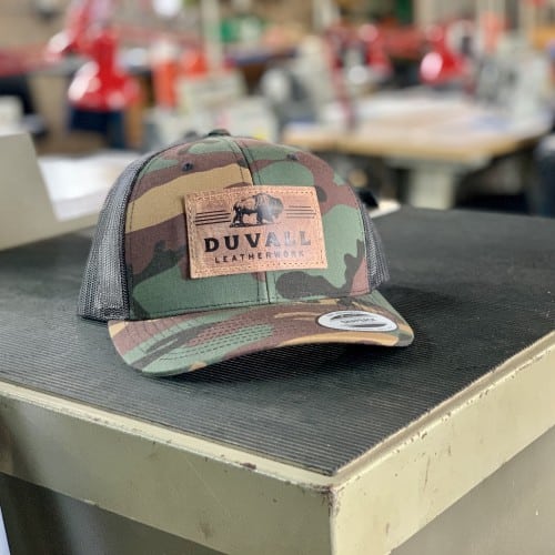 Camo trucker hat with genuine leather patch