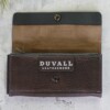 Full grain women's gray leather walle shown open to reveal the Duvall logo inside the front