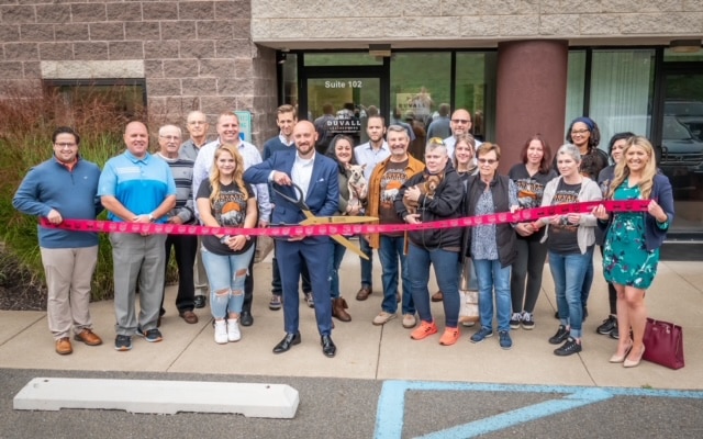 Small business ribbon cutting at their new workshop