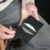 Small black wallet holds credit cards