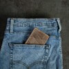 Vintage brown money clip wallet in jean pocket