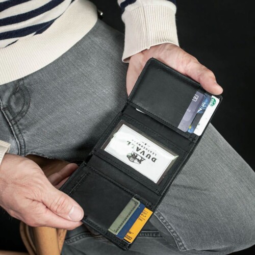 man showing credit cards in trifold wallet