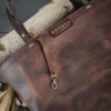 Brown leather tote bag with key ring