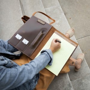 Women writing in padfolio