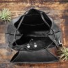 Black leather bag opening with drawstring