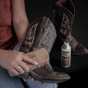 cleaning leather boots with bristle brush
