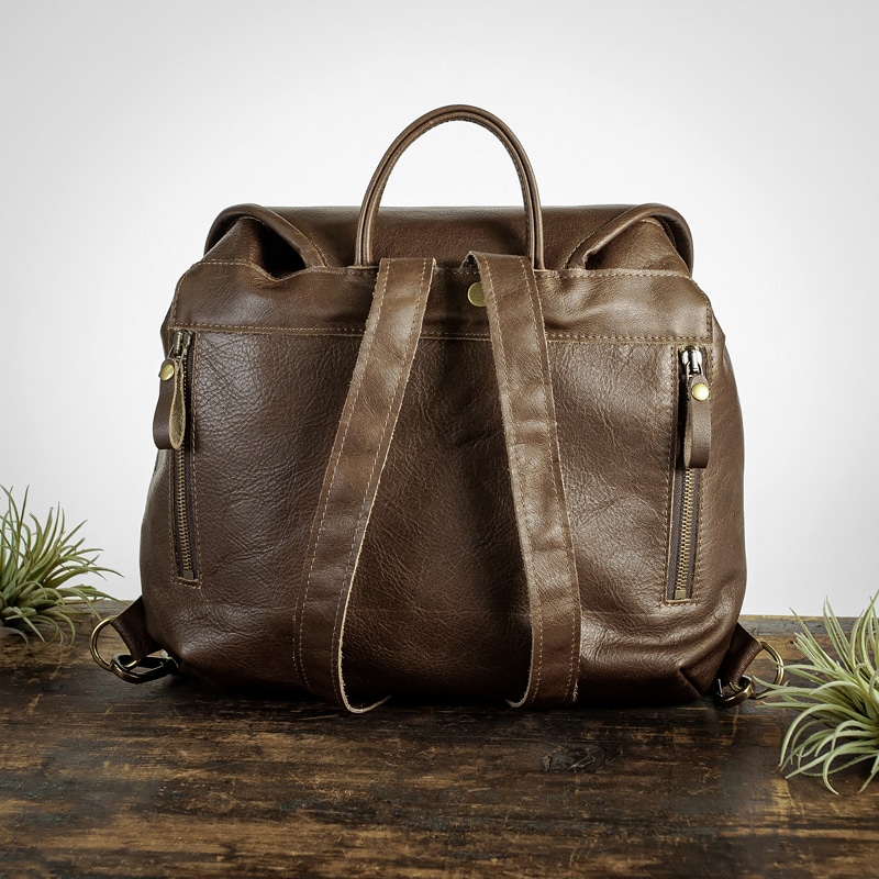 Dark brown leather backpack with exterior zipper pockets