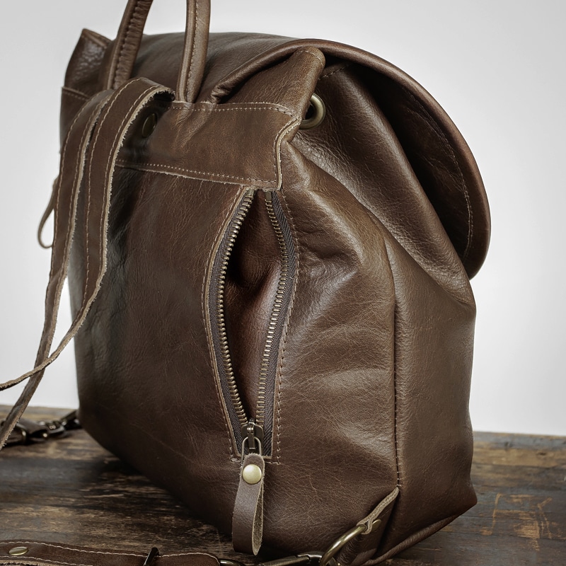 Brown backpack purse with side pockets