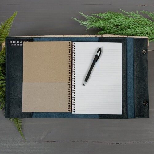 Large blue journal cover includes notebook and pen