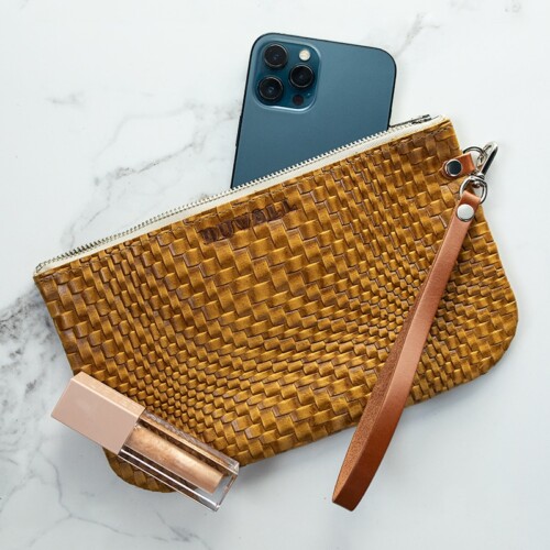 Yellow woven textured wristlet with blue iPhone and sparkle lip gloss