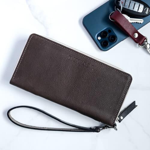 Ash Grey ladies wallet with wristlet strap with phone and keys beside