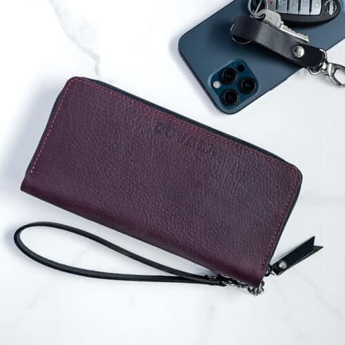 Sangria Purple women's wallet with phone and keys on the side