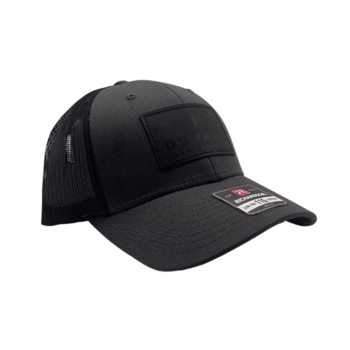 charcoal and black leather patch trucker style hat