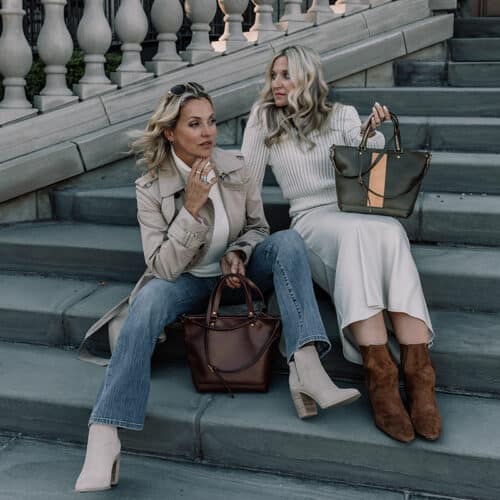 two ladies with purses in purple and green and tan