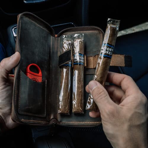 Cigar travel case which holds 3 cigars.