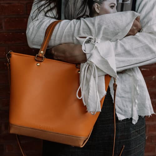 Italian leather purse made by Duvall Leather in Vixen Orange.