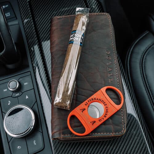 Whiskey color cigar case with cigar and cutter